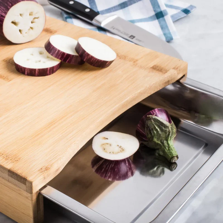 Bamboo cutting board with pull-out steel tray
