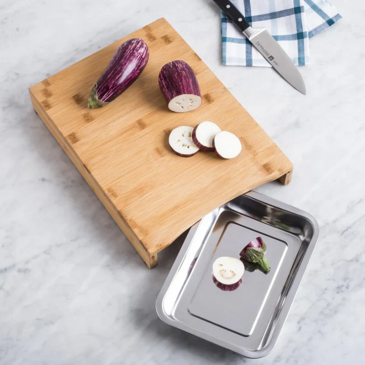 Bamboo cutting board with pull-out steel tray